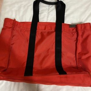 Tumi Red travel bag